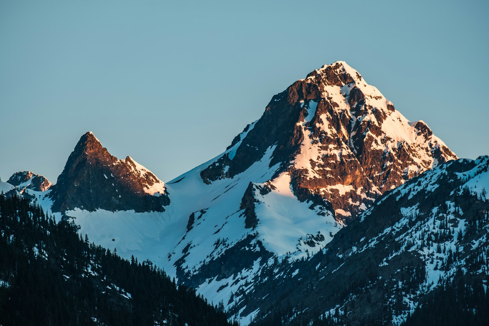 a snow covered mountain with a sky background